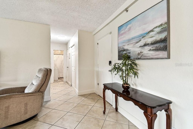 3315 58th Ave S Unit 311, Saint Petersburg, FL 33712 - entrance foyer with light tile patterned floors and a textured ceiling
