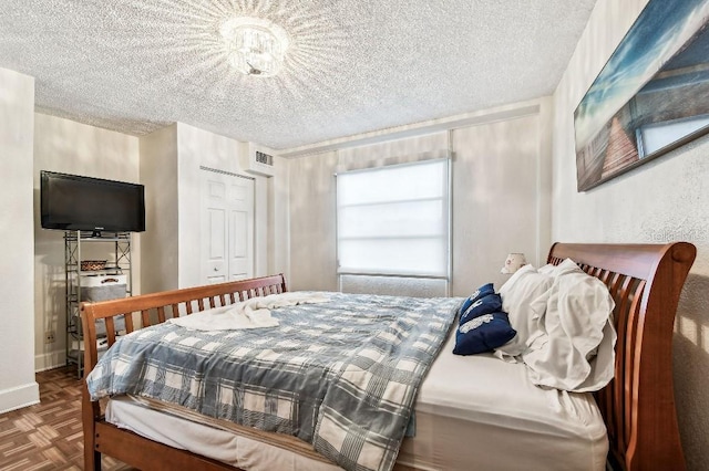 3315 58th Ave S Unit 311, Saint Petersburg, FL 33712 - bedroom with a textured ceiling and a closet