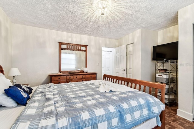 3315 58th Ave S Unit 311, Saint Petersburg, FL 33712 - bedroom with a textured ceiling and a closet