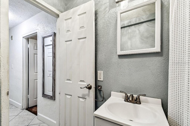 3315 58th Ave S Unit 311, Saint Petersburg, FL 33712 - bathroom featuring a textured wall and a textured ceiling