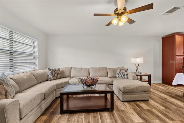 4945 91st Ave N Unit 30, Pinellas Park, FL 33782 - living room featuring wood finished floors and a ceiling fan