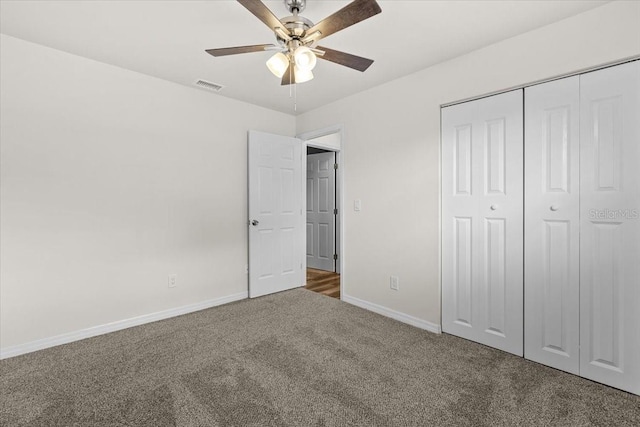 4945 91st Ave N Unit 30, Pinellas Park, FL 33782 - unfurnished bedroom with carpet, a closet, and ceiling fan