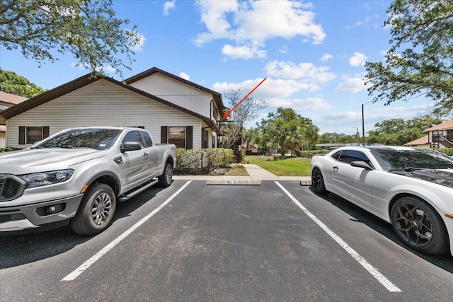 4945 91st Ave N Unit 30, Pinellas Park, FL 33782 - uncovered parking lot with stairs