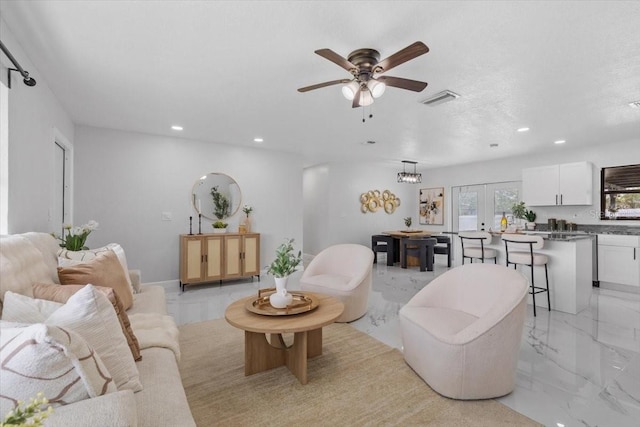 6370 Elmhurst Dr, Pinellas Park, FL 33782 - living room featuring recessed lighting, light marble finish flooring, french doors, and ceiling fan