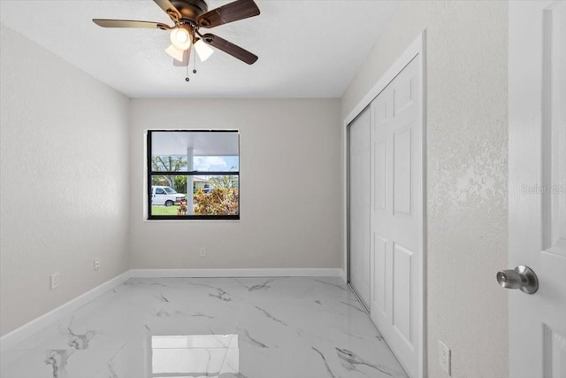 6370 Elmhurst Dr, Pinellas Park, FL 33782 - unfurnished bedroom with light marble finish flooring, a closet, and ceiling fan