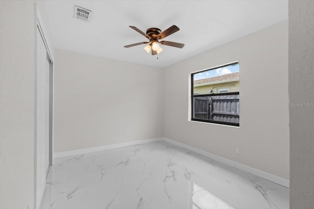 6370 Elmhurst Dr, Pinellas Park, FL 33782 - empty room featuring a ceiling fan and marble look tile flooring
