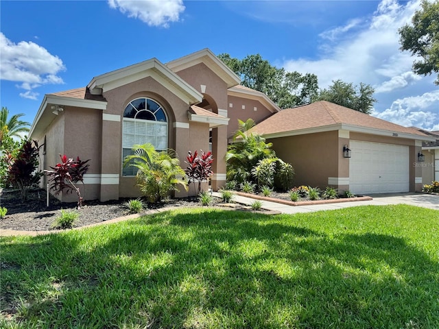 28826 Windover St, Wesley Chapel, FL 33545 - view of front of home featuring stucco siding, a front yard, an attached garage, and concrete driveway
