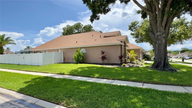 28826 Windover St, Wesley Chapel, FL 33545 - view of property exterior with stucco siding