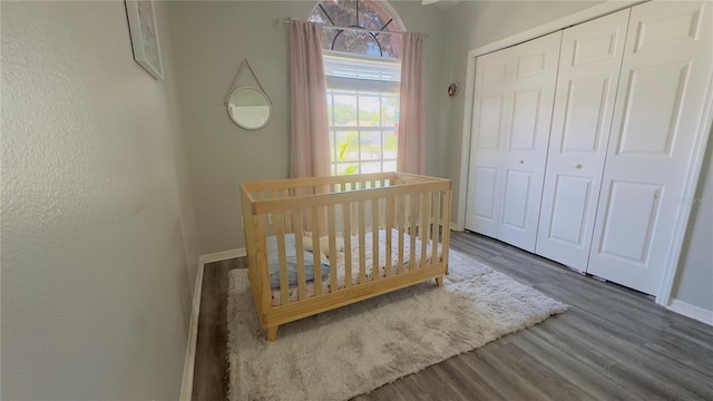 28826 Windover St, Wesley Chapel, FL 33545 - bedroom with wood finished floors, a closet, and a crib