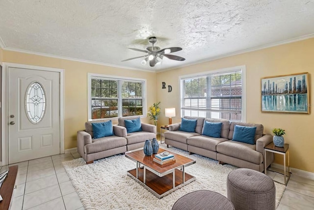 109 Emerald Ln, Largo, FL 33771 - living area featuring plenty of natural light, ceiling fan, ornamental molding, light tile patterned floors, and a textured ceiling
