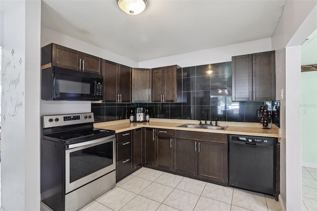 109 Emerald Ln, Largo, FL 33771 - kitchen with black appliances, tasteful backsplash, dark brown cabinets, light countertops, and light tile patterned flooring