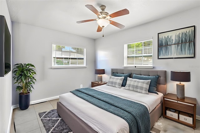 109 Emerald Ln, Largo, FL 33771 - tiled bedroom featuring multiple windows and ceiling fan