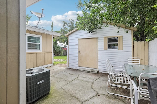 109 Emerald Ln, Largo, FL 33771 - view of patio featuring an outdoor structure and outdoor dining area