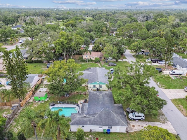 1711 W Followthru Dr, Tampa, FL 33612 - aerial view of property and surrounding area featuring a pool area and nearby suburban area