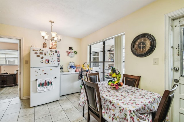 1711 W Followthru Dr, Tampa, FL 33612 - dining area featuring healthy amount of natural light, a chandelier, and light tile patterned floors