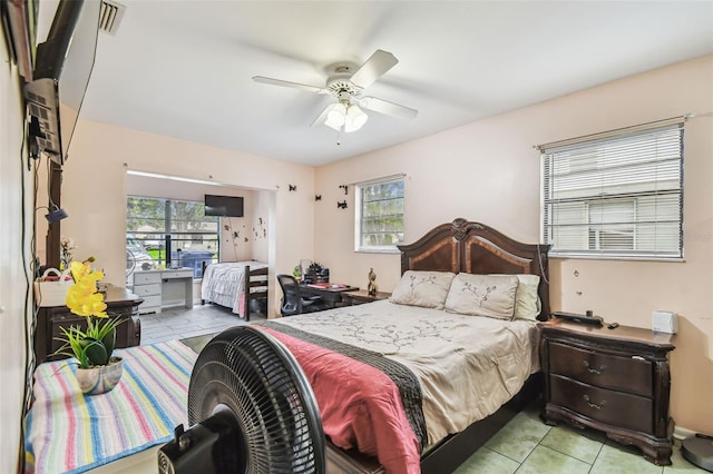 1711 W Followthru Dr, Tampa, FL 33612 - tiled bedroom with ceiling fan