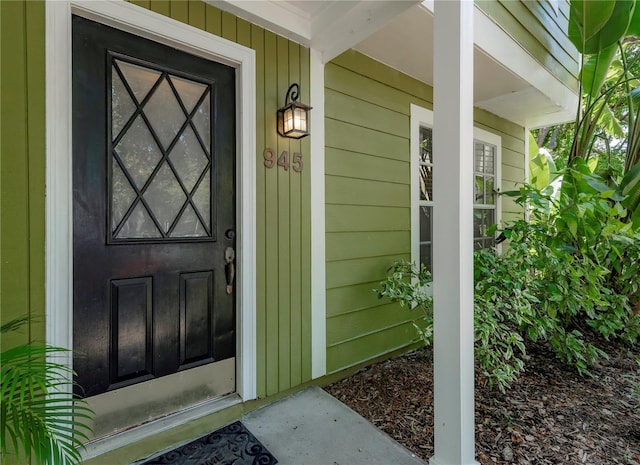 945 Hamilton Ct, Palm Harbor, FL 34683 - property entrance featuring covered porch