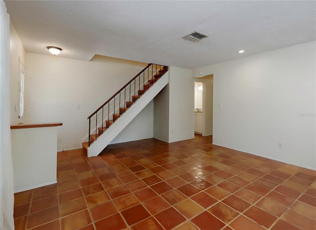 945 Hamilton Ct, Palm Harbor, FL 34683 - unfurnished living room with a textured ceiling, stairway, and recessed lighting