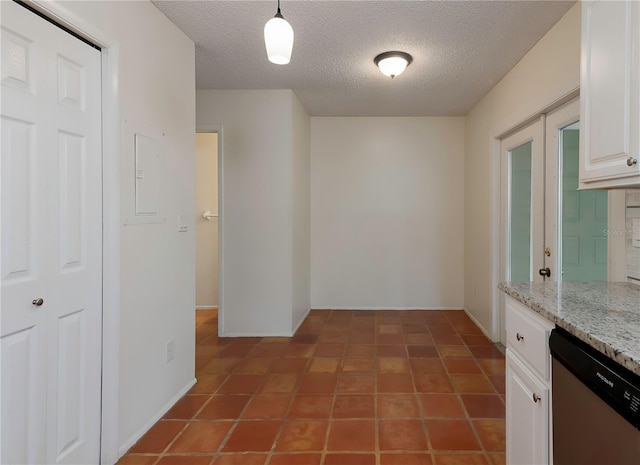 945 Hamilton Ct, Palm Harbor, FL 34683 - unfurnished dining area featuring a textured ceiling and electric panel