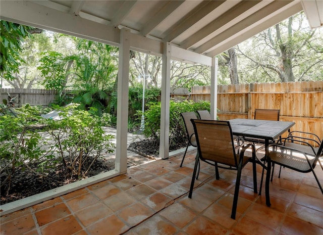 945 Hamilton Ct, Palm Harbor, FL 34683 - fenced backyard with a patio area and outdoor dining space