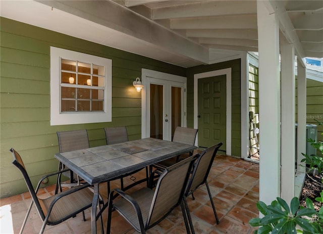 945 Hamilton Ct, Palm Harbor, FL 34683 - view of patio / terrace featuring outdoor dining space and french doors