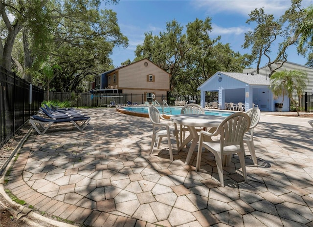945 Hamilton Ct, Palm Harbor, FL 34683 - view of patio / terrace featuring a community pool
