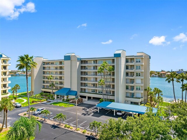7892 Sailboat Key Blvd S Unit 408, South Pasadena, FL 33707 - view of apartment building / complex featuring a water view and uncovered parking