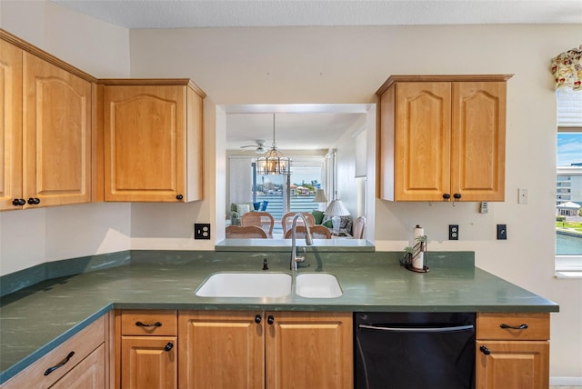 7892 Sailboat Key Blvd S Unit 408, South Pasadena, FL 33707 - kitchen featuring dishwasher, dark countertops, and plenty of natural light