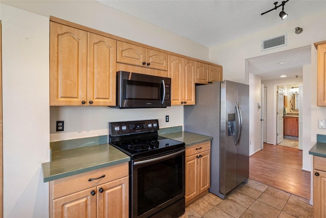 7892 Sailboat Key Blvd S Unit 408, South Pasadena, FL 33707 - kitchen featuring electric stove, stainless steel fridge, light tile patterned floors, light brown cabinetry, and dark countertops