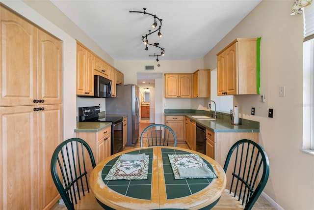 7892 Sailboat Key Blvd S Unit 408, South Pasadena, FL 33707 - kitchen featuring black appliances and light brown cabinets