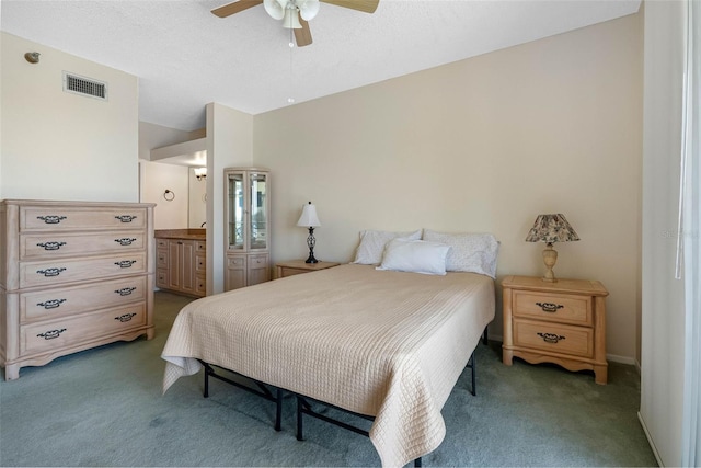 7892 Sailboat Key Blvd S Unit 408, South Pasadena, FL 33707 - bedroom with light carpet, connected bathroom, and a ceiling fan
