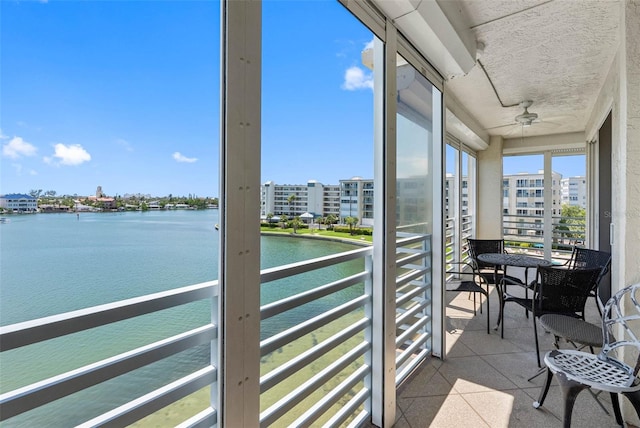 7892 Sailboat Key Blvd S Unit 408, South Pasadena, FL 33707 - sunroom with a water view and a ceiling fan