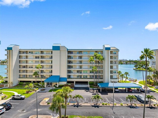 7892 Sailboat Key Blvd S Unit 408, South Pasadena, FL 33707 - view of apartment building / complex with uncovered parking and a water view