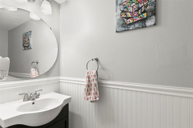 6681 121st Ave Unit I, Largo, FL 33773 - bathroom with wainscoting and vanity