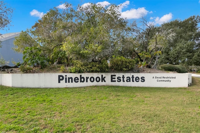 6681 121st Ave Unit I, Largo, FL 33773 - community sign with a lawn