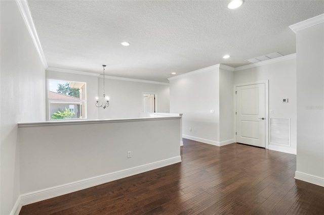 4920 Anniston Cir, Tampa, FL 33647 - spare room with dark wood-type flooring, a chandelier, a textured ceiling, recessed lighting, and crown molding