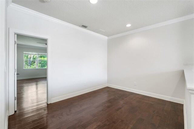 4920 Anniston Cir, Tampa, FL 33647 - unfurnished room with dark wood-type flooring, ornamental molding, and recessed lighting