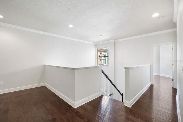 4920 Anniston Cir, Tampa, FL 33647 - corridor featuring an upstairs landing, wood finished floors, recessed lighting, a textured ceiling, and a chandelier