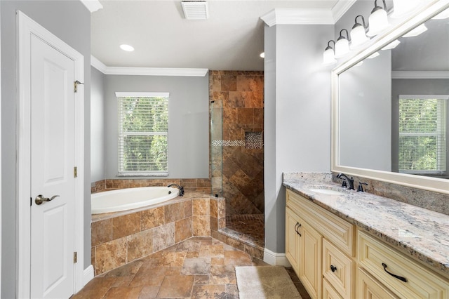 4920 Anniston Cir, Tampa, FL 33647 - full bathroom featuring healthy amount of natural light, stone tile flooring, a garden tub, vanity, and crown molding
