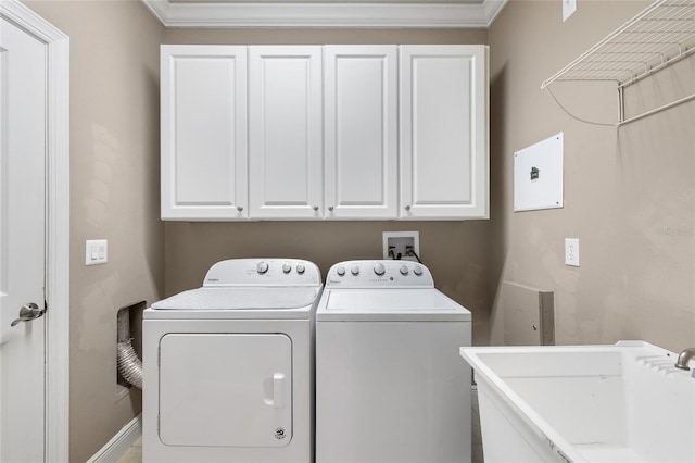 4920 Anniston Cir, Tampa, FL 33647 - laundry room featuring washing machine and dryer, crown molding, and cabinet space