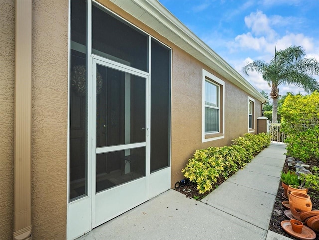 7606 Berna Ln, Land O Lakes, FL 34637 - view of home's exterior with stucco siding