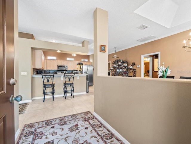 7606 Berna Ln, Land O Lakes, FL 34637 - foyer featuring light tile patterned floors, a chandelier, and ornamental molding
