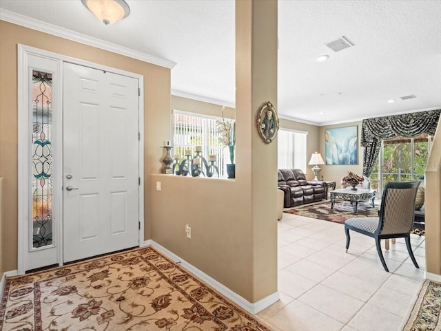 7606 Berna Ln, Land O Lakes, FL 34637 - foyer with crown molding, healthy amount of natural light, a textured ceiling, and light tile patterned flooring