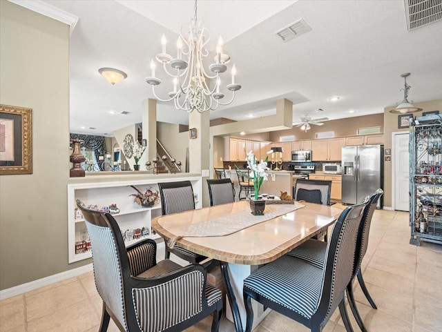 7606 Berna Ln, Land O Lakes, FL 34637 - dining area with a chandelier, light tile patterned flooring, and a ceiling fan
