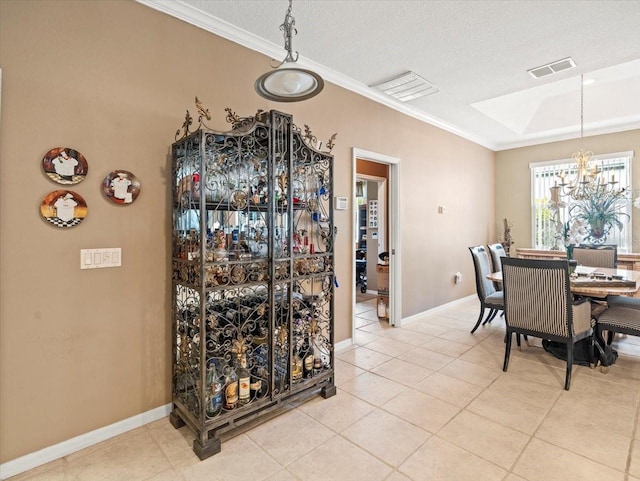 7606 Berna Ln, Land O Lakes, FL 34637 - dining space featuring crown molding, a chandelier, light tile patterned floors, and a textured ceiling
