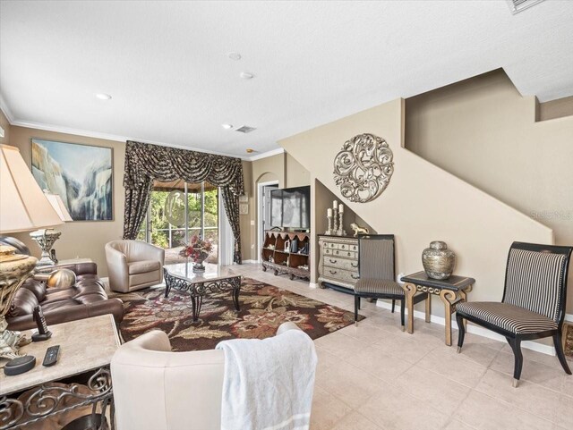 7606 Berna Ln, Land O Lakes, FL 34637 - living room with ornamental molding, light tile patterned floors, and recessed lighting