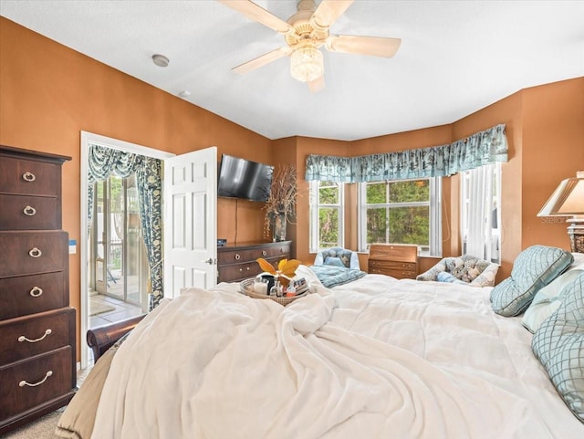 7606 Berna Ln, Land O Lakes, FL 34637 - bedroom featuring access to exterior and a ceiling fan