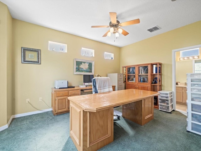 7606 Berna Ln, Land O Lakes, FL 34637 - home office with dark carpet and a ceiling fan