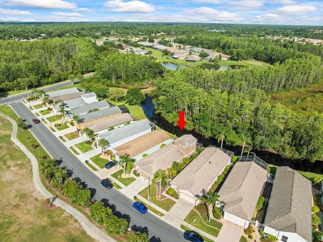 7606 Berna Ln, Land O Lakes, FL 34637 - aerial view of property's location with nearby suburban area and a nearby body of water