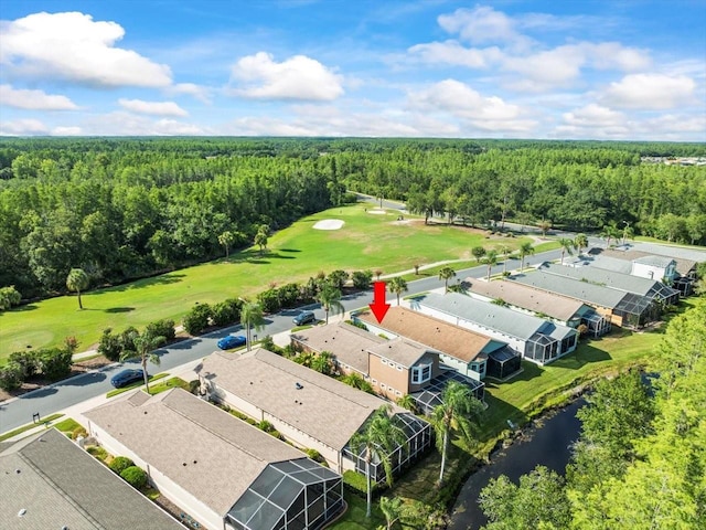 7606 Berna Ln, Land O Lakes, FL 34637 - drone / aerial view of a golf course and a nearby body of water
